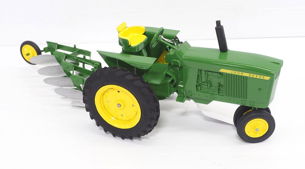 Lot 87: John Deere Tractor with 4-Bottom Plow