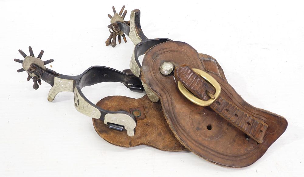 Lot 1003: Pair of fancy silver spurs