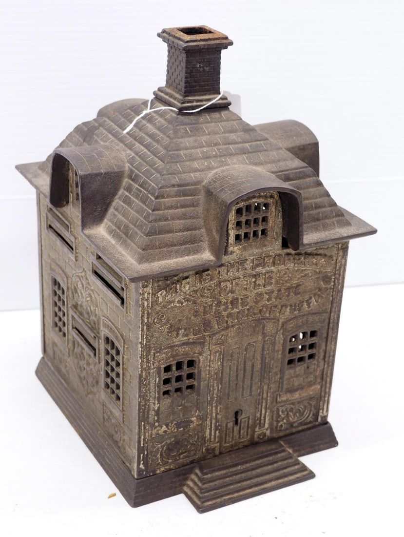 Lot 1030: Cast iron bank