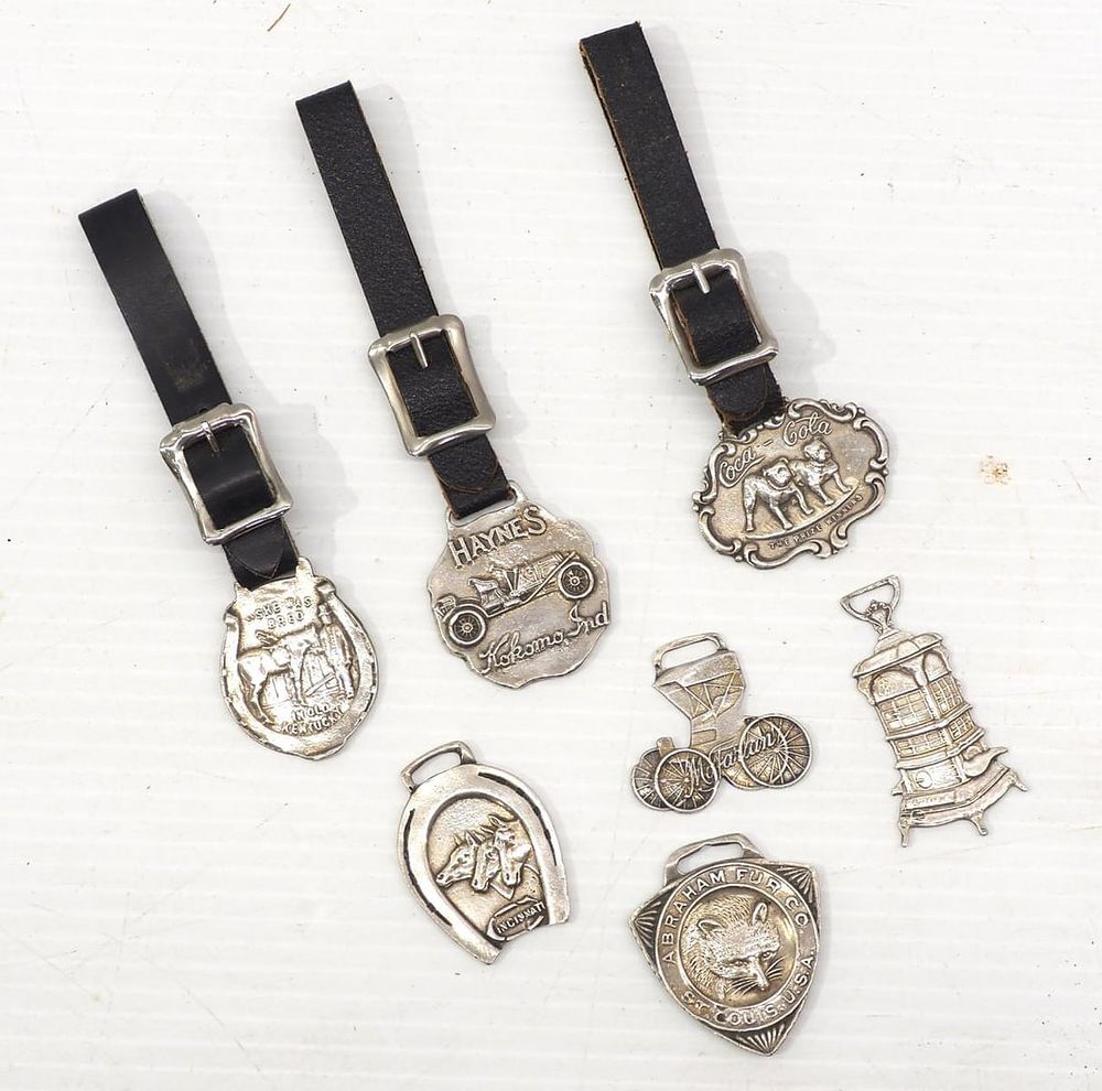 Lot 1048: (7) Sterling silver watch fobs