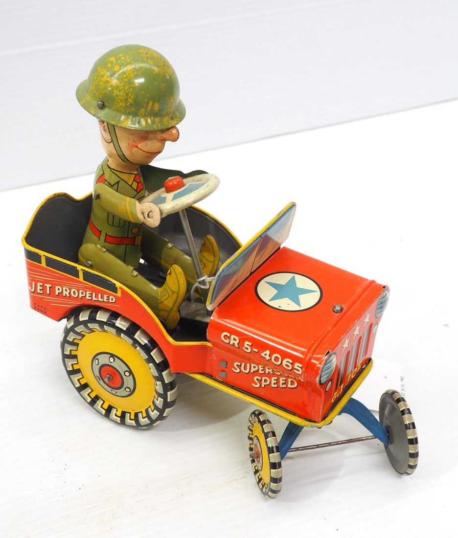Lot 1051: Unique Art tin wind-up G.I. Joe Jouncing Jeep