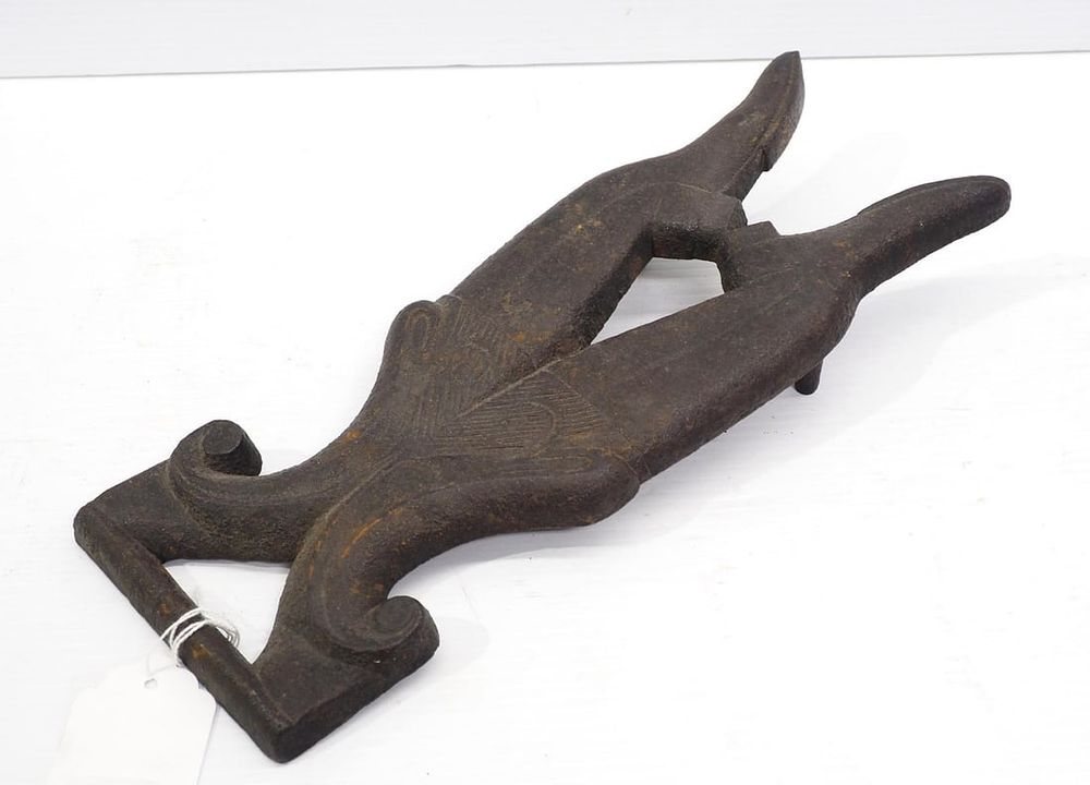Lot 1133: Cast iron boot jack