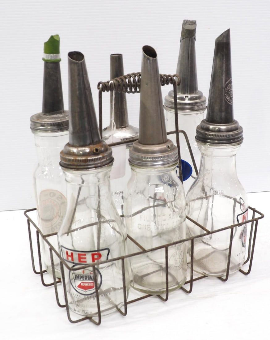 Lot 1184: (6) 1-quart oil bottles with wire carrier