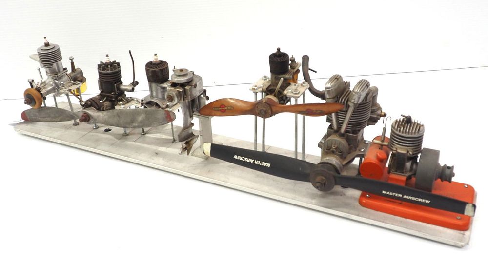 Lot 1188: Display of model boat motor and airplane engines
