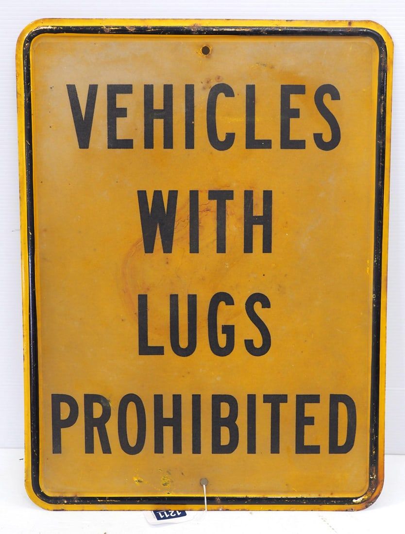 Lot 1211: Vehicles with Lugs Prohibited sign