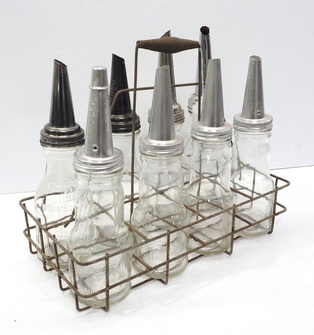 Lot 1214: (8) 1-quart oil bottles with spouts and carrier