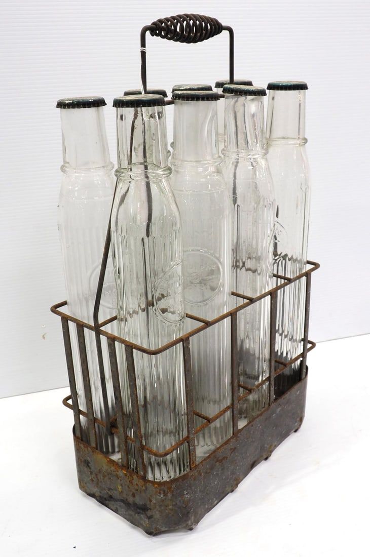 Lot 1217: Tiolene oil bottles with wire carrier