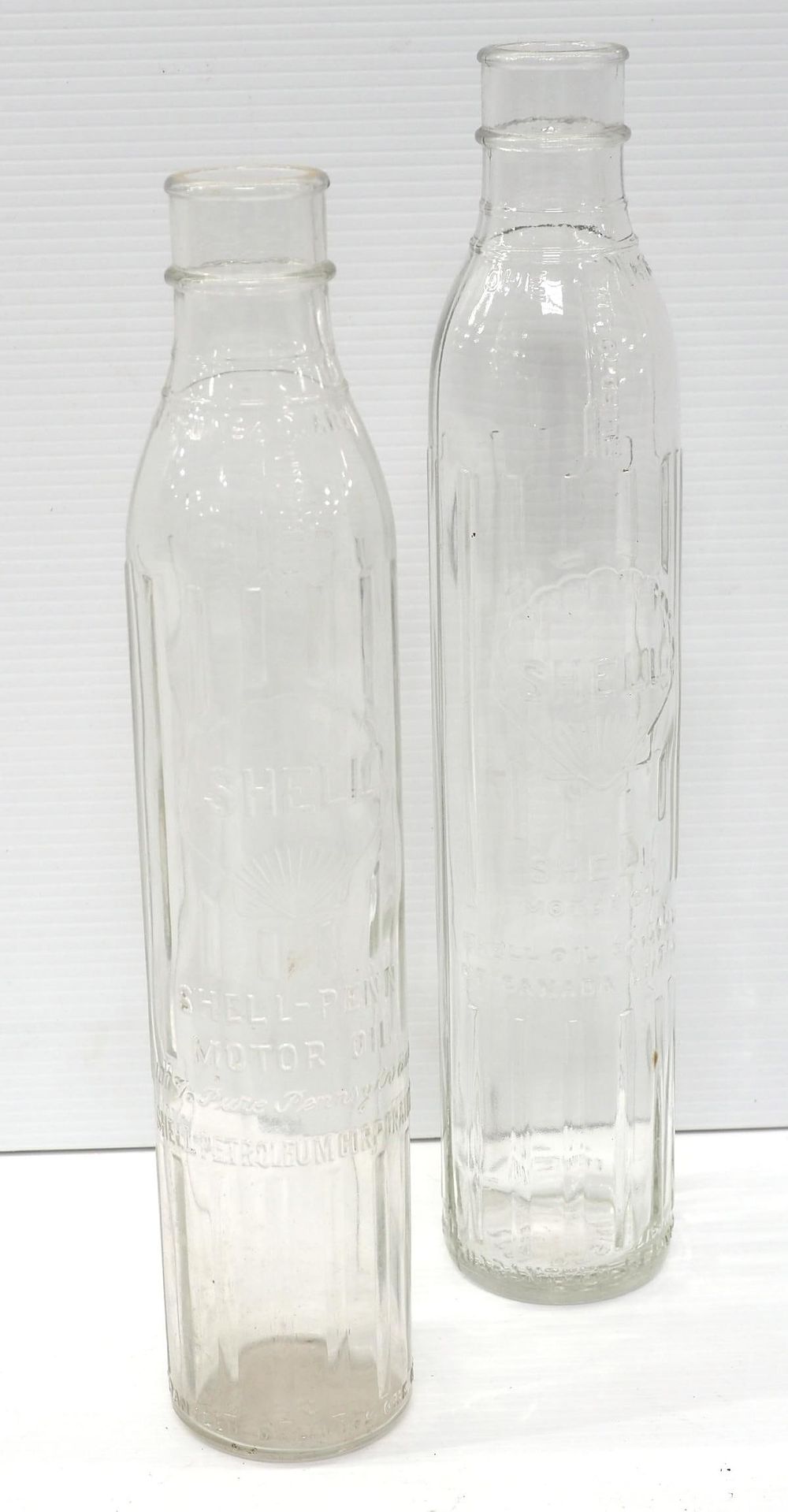 Lot 1223: (2) Shell tall 1-quart glass oil bottles