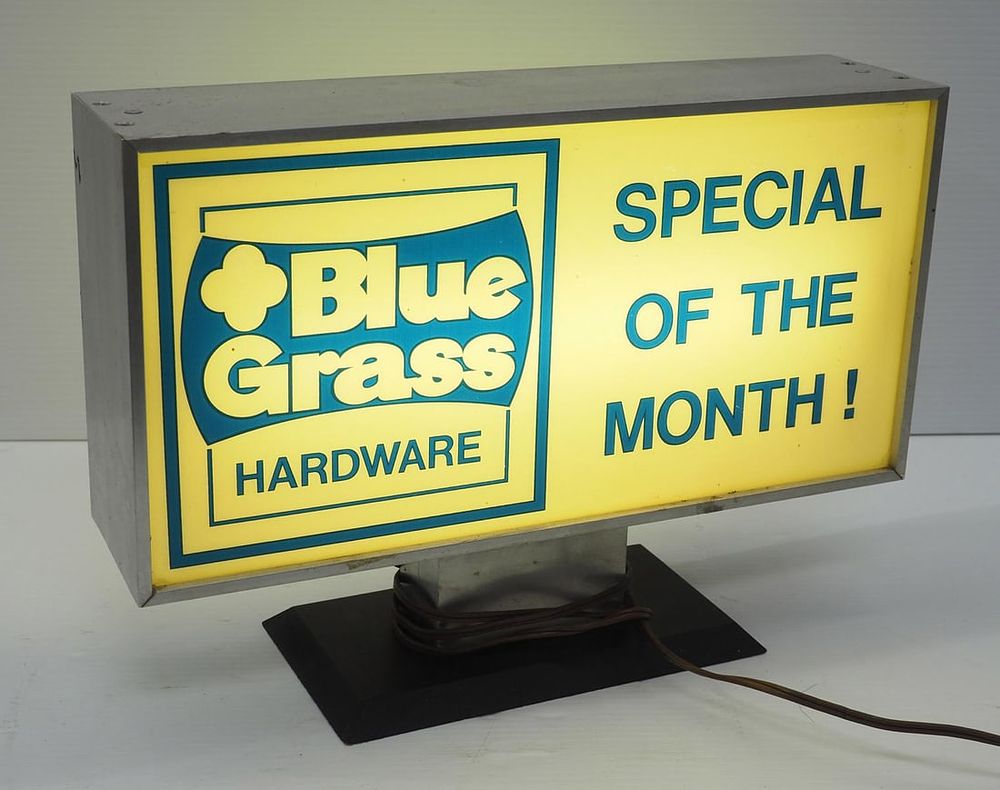 Lot 1244: Blue Grass Hardware countertop sign