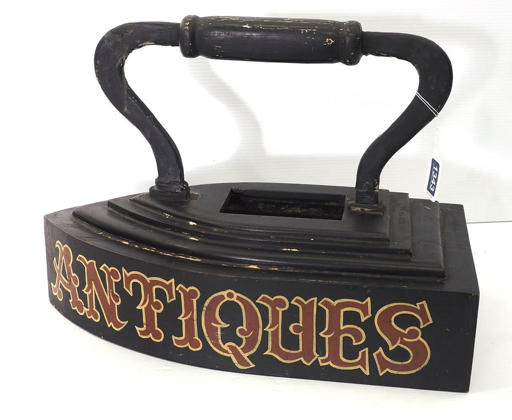 Lot 1343: Wooden sad iron trade sign