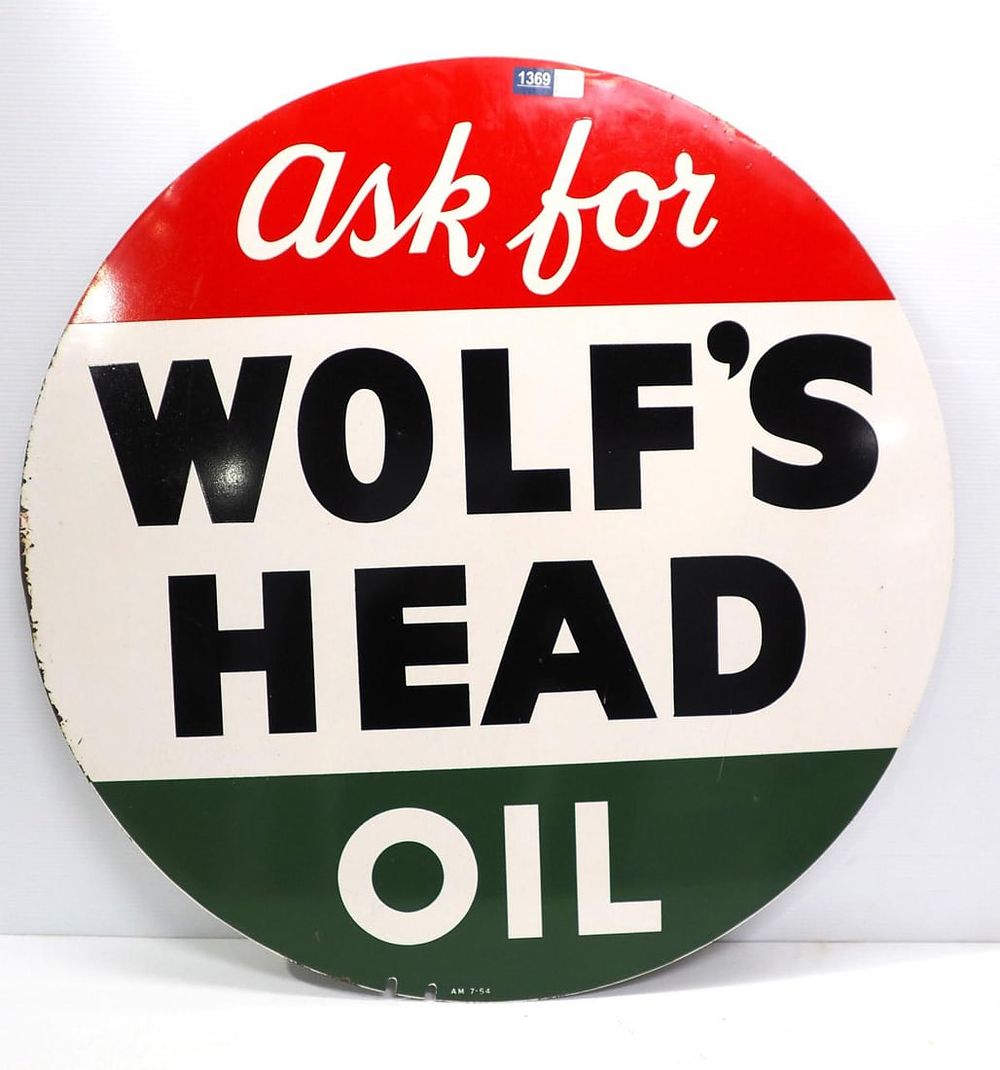 Lot 1369: Ask For Wolf's Head Oil sign