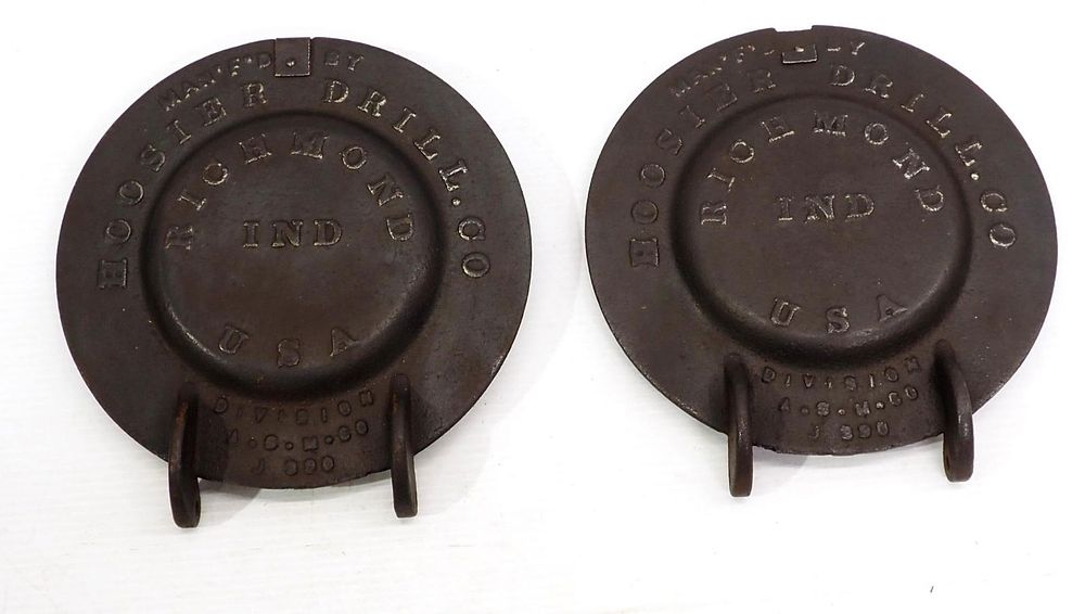 Lot 88: Pair of cast iron Hoosier Drill Co. planter box lids