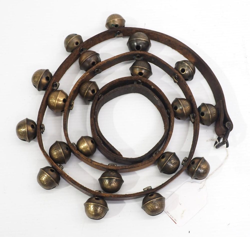 Lot 174: Leather strap with brass harness bells