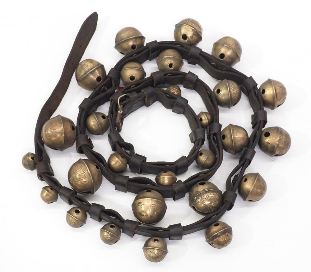 Lot 175: Leather strap with brass harness bells