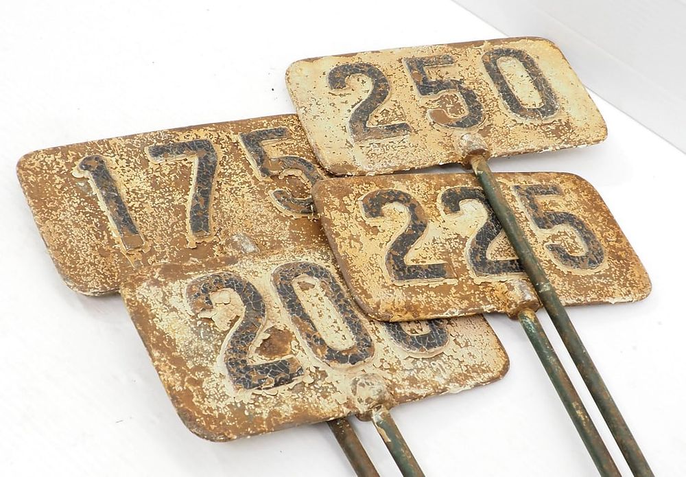 Lot 180: (4) Cast iron golf yardage signs