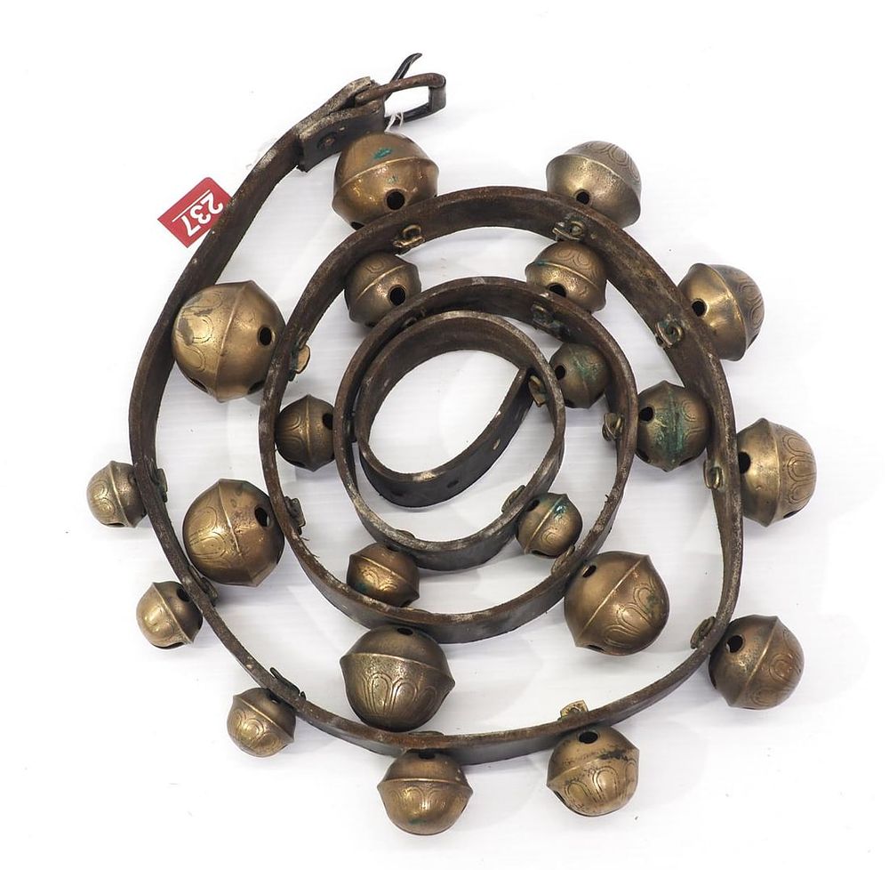 Lot 237: Leather strap with graduated brass harness bells