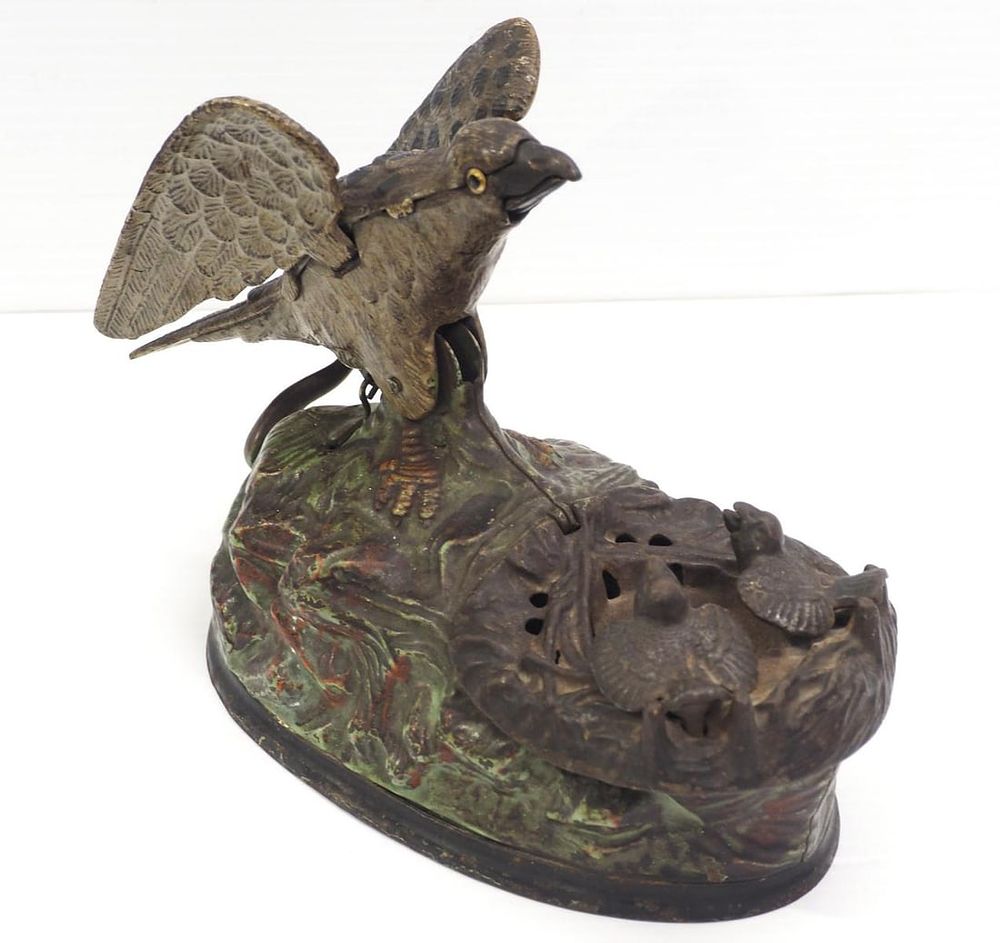 Lot 247: Eagle with eaglets cast iron mechanical bank