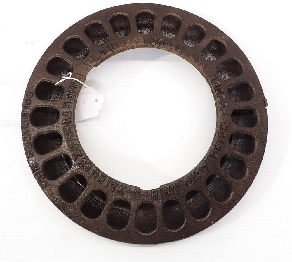 Lot 720: Cast iron Chick-O-Ring chick feeder