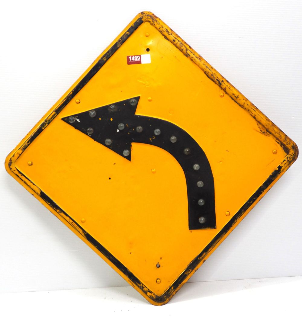 Lot 1489: Curve road sign with cat eye marbles