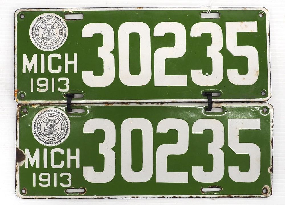 Lot 2242: Pair of 1913 porcelain Michigan license plates