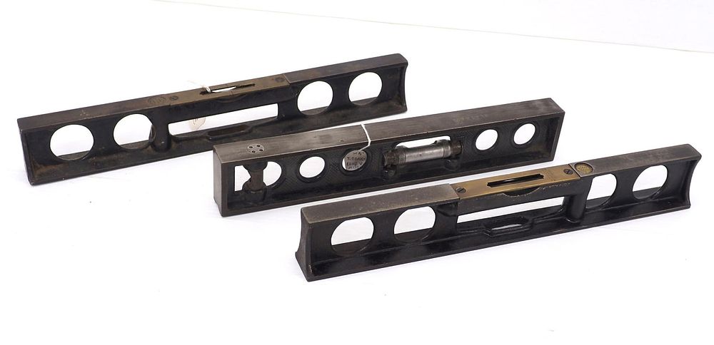 Lot 574: (3) Cast iron levels