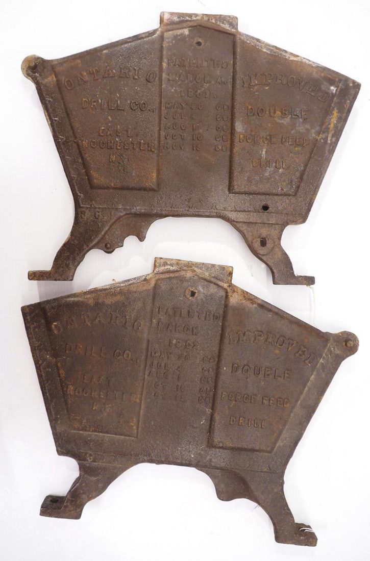 Lot 331: Pair of cast iron Ontario Drill Co. planter box ends