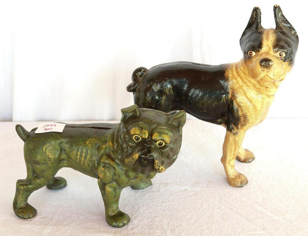 Lot 1047: (2) Cast iron Dog Door Stop Banks
