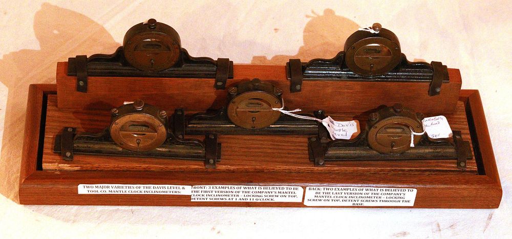 Lot 529: (5) Davis Mantel Clock Inclinometers