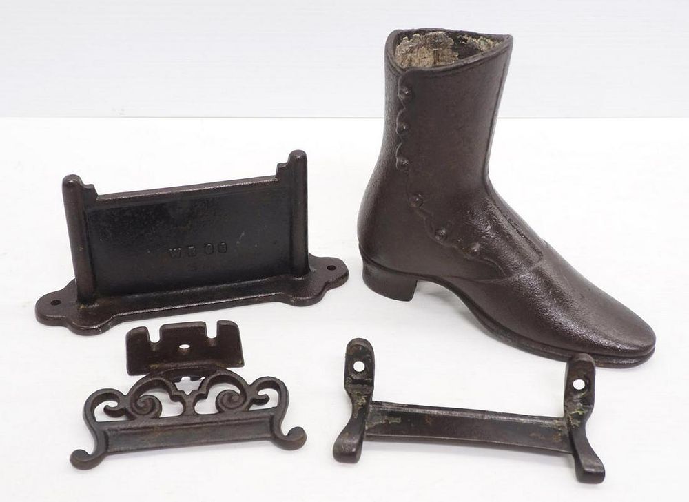 Lot 1132: (3) Cast iron boot scrapers / Cast iron shoe