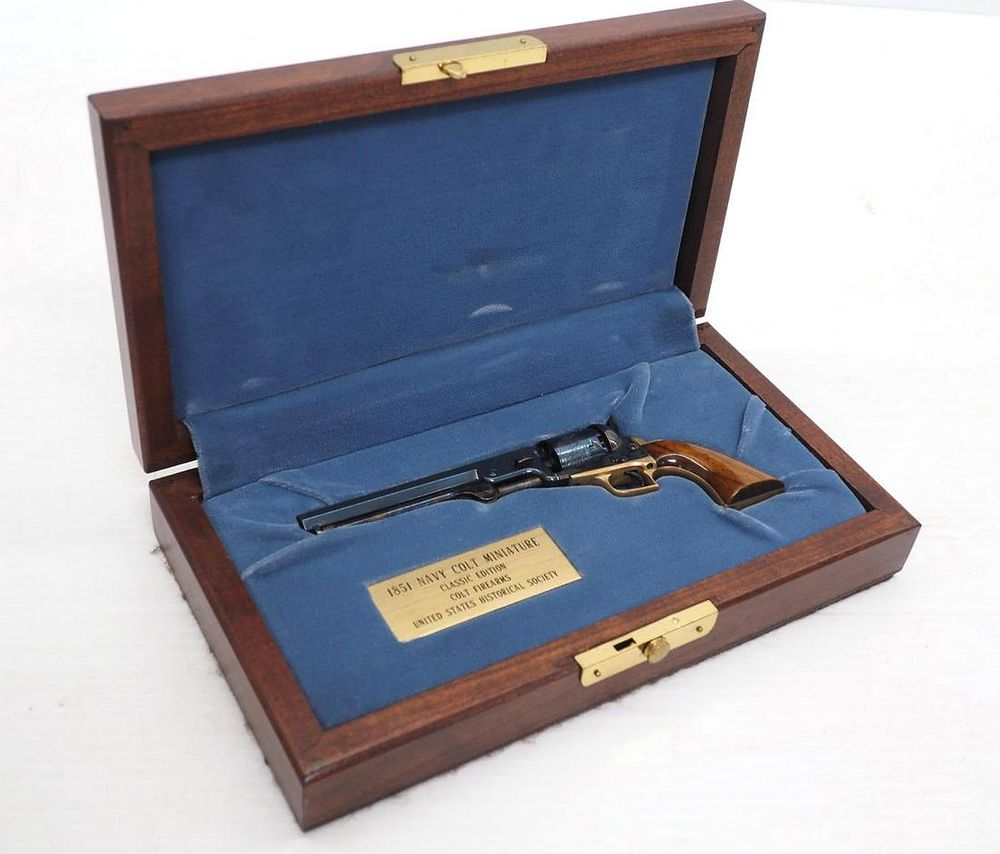 Lot 1141: 1851 Navy Colt miniature pistol replica