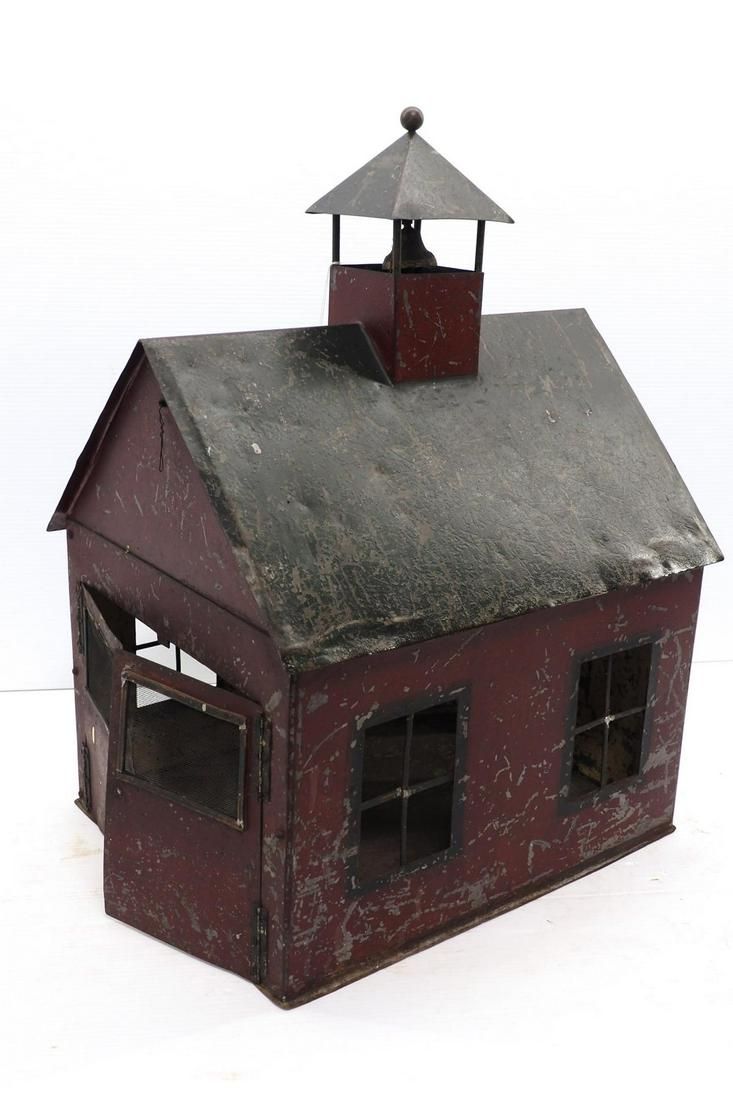 Lot 1215: Tin schoolhouse toy
