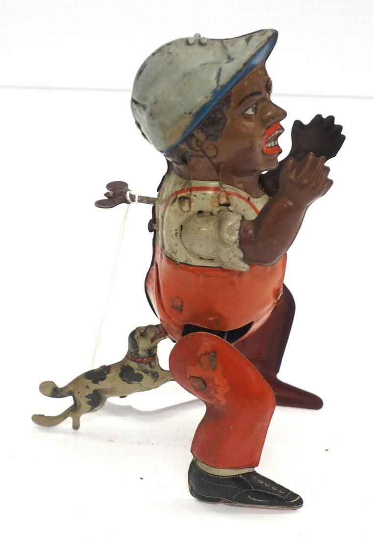 Lot 1271: Tin wind-up of boy