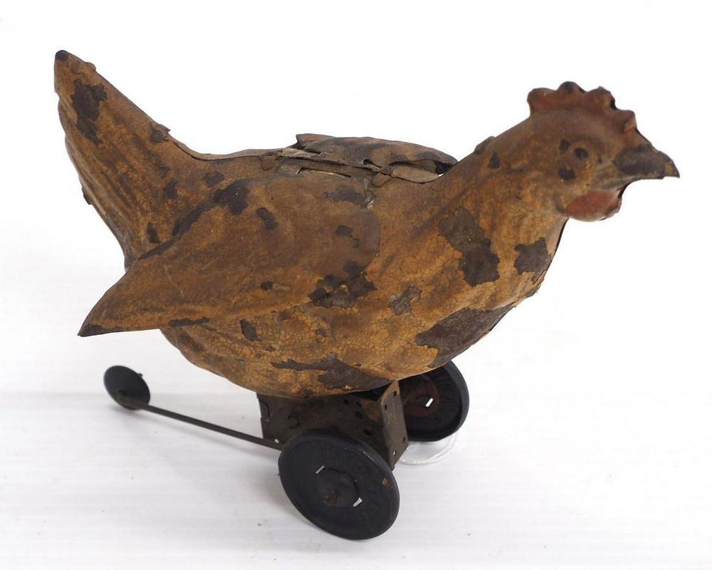 Lot 1273: Tin wind-up chicken toy