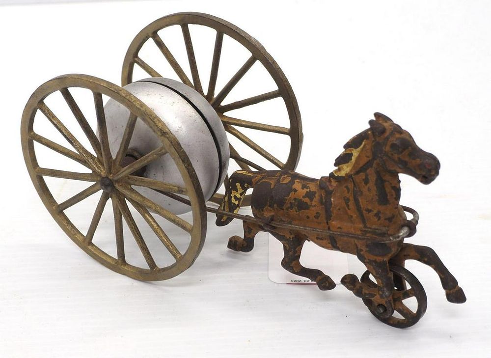 Lot 1274: Cast iron pull-type horse bell toy