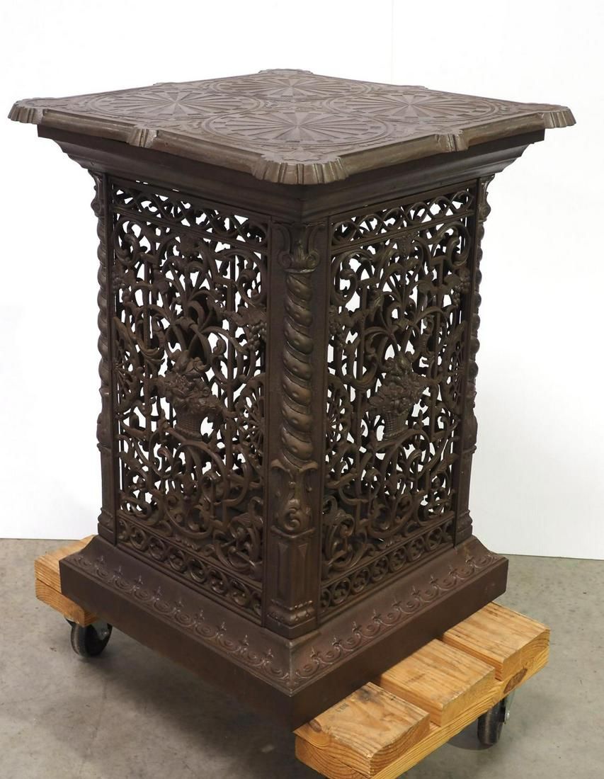 Lot 1342: Cast iron ornate floor model register warming stand