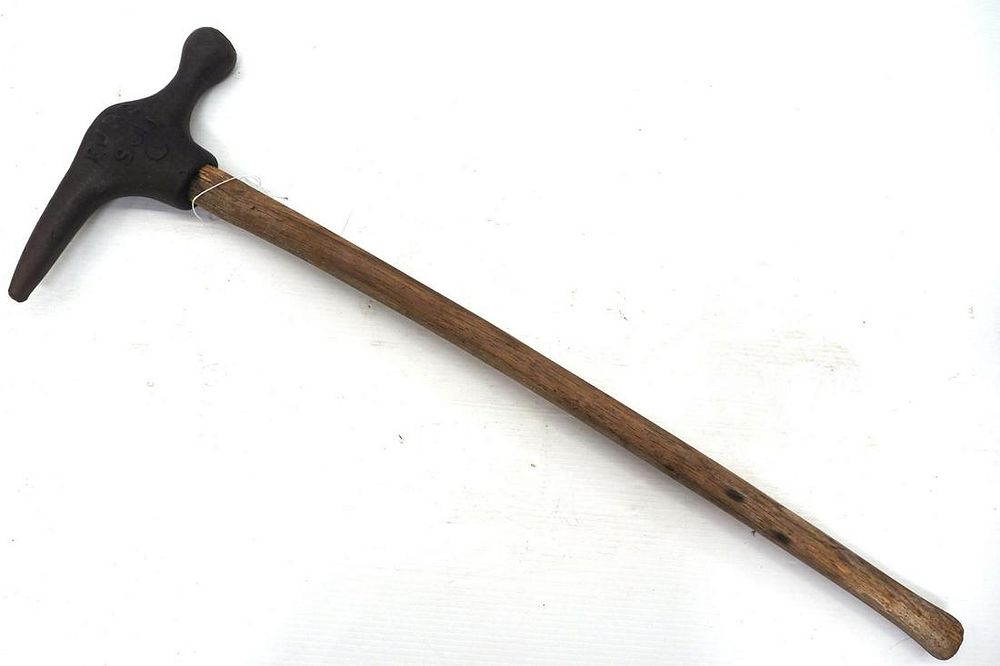 Lot 1379: Cast iron EJ & E hammer