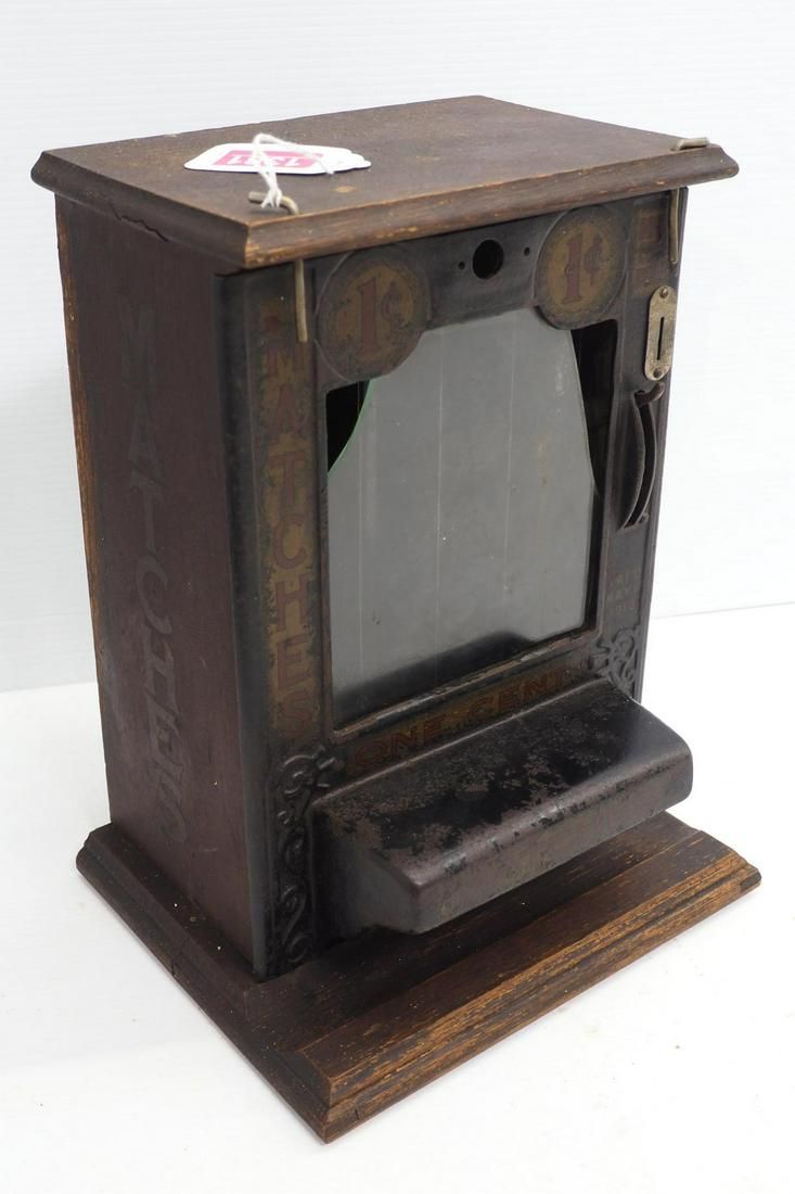 Lot 1381: Cast iron & wood 1-cent match machine