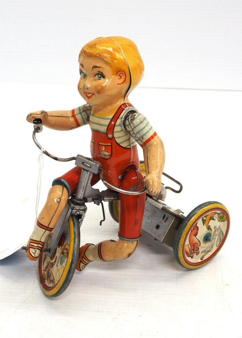 Lot 74: Unique Art wind-up Kiddy Cyclist toy