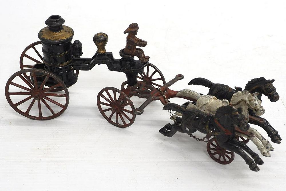 Lot 112: Ives cast iron horse-drawn fire wagon