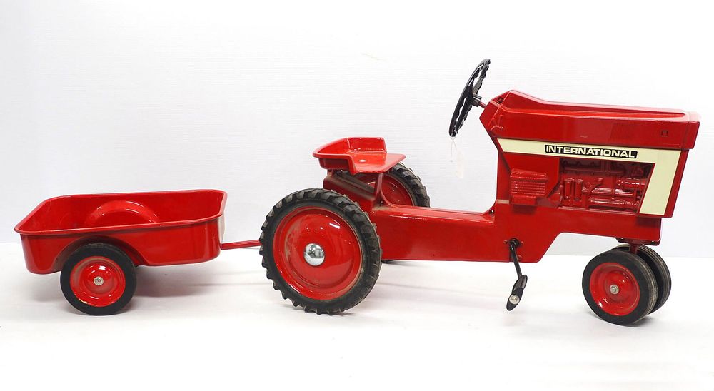 Lot 116: Ertl International  pedal tractor & trailer