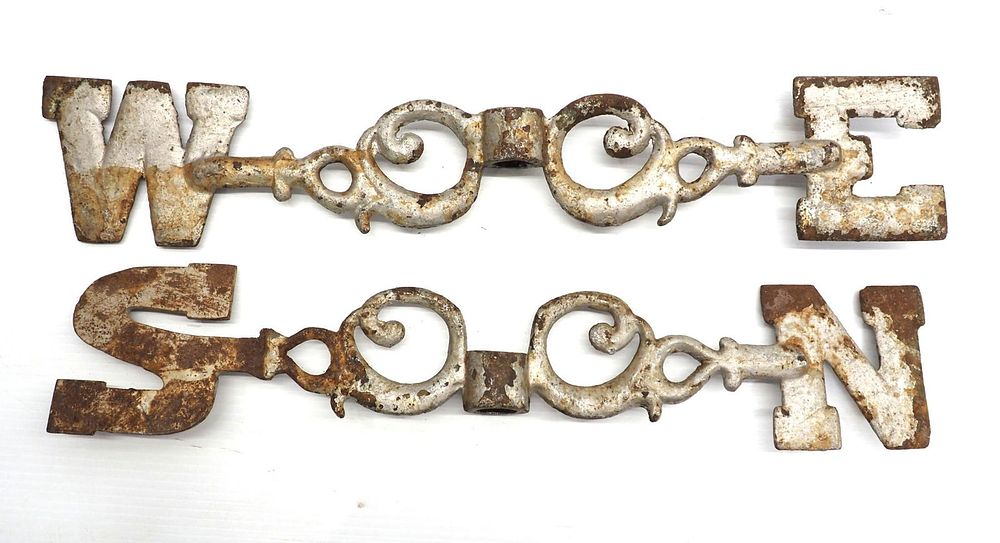 Lot 128: Cast iron weathervane directionals