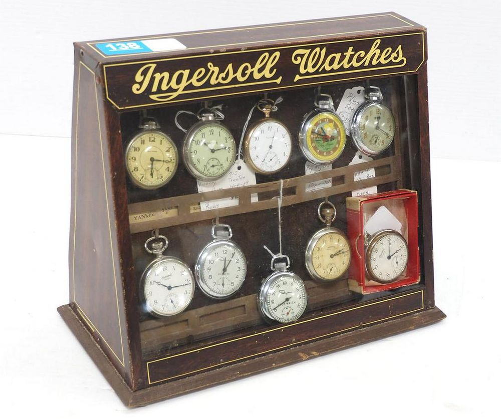 Lot 138: Ingersoll Watches tin & wood display case