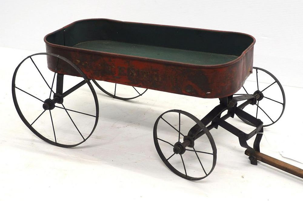 Lot 172: Child's pull type metal & wood wagon