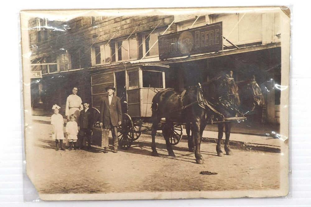 Lot 251: Photograph with early John Deere Plows sign