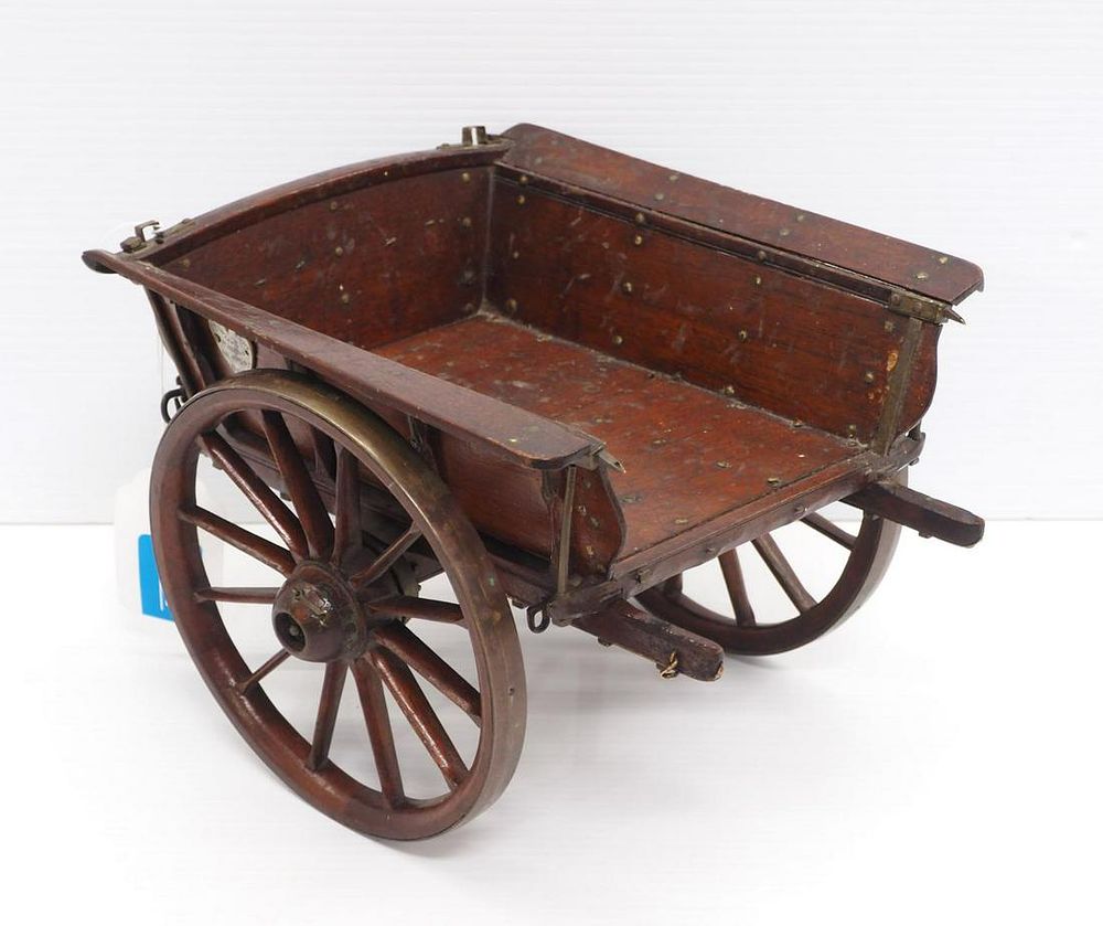 Lot 271: Wood & brass salesman sample 2-wheel cart