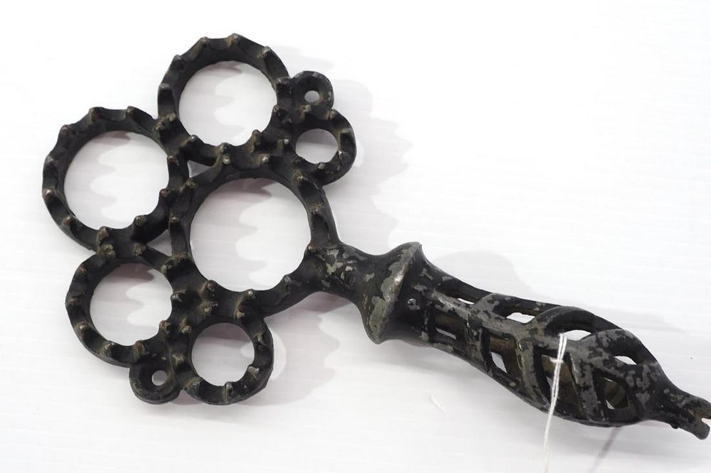 Lot 337: 6-hole cast iron hand corn sheller with nail puller