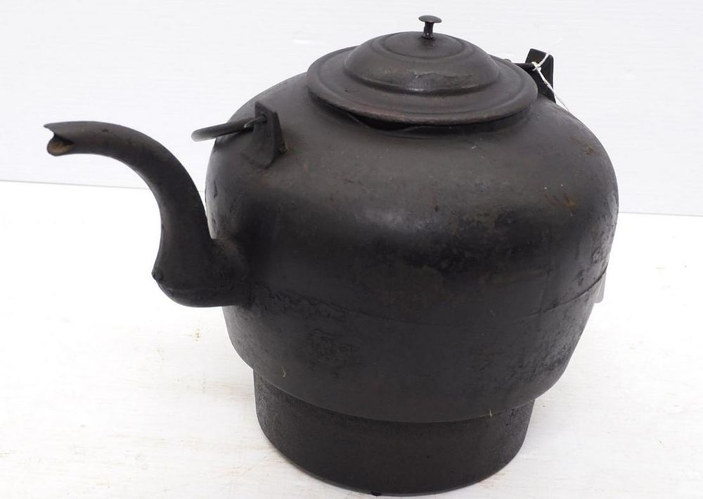 Lot 368: Cast iron tea kettle