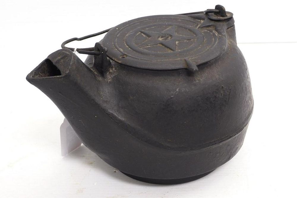Lot 395: Cast iron tea kettle