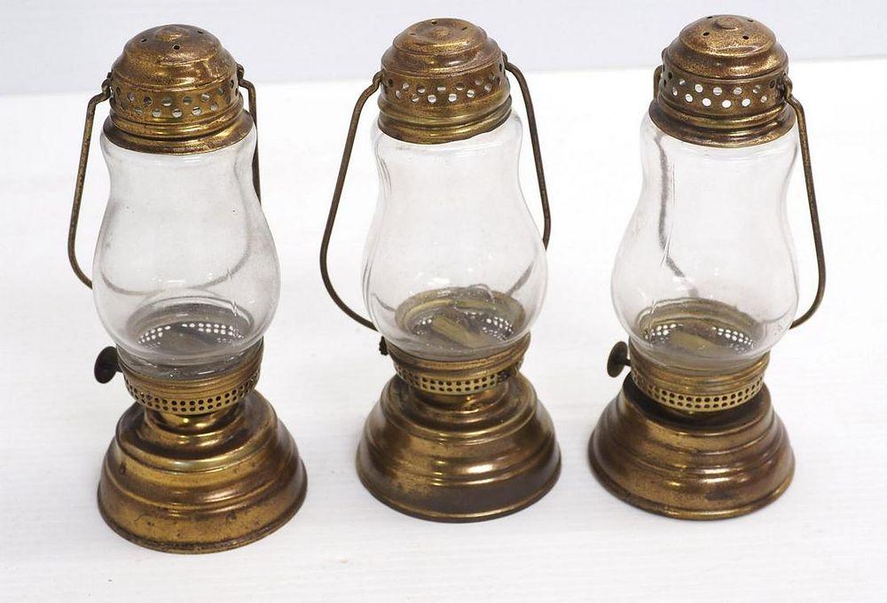 Lot 571: (3) Brass skater lanterns
