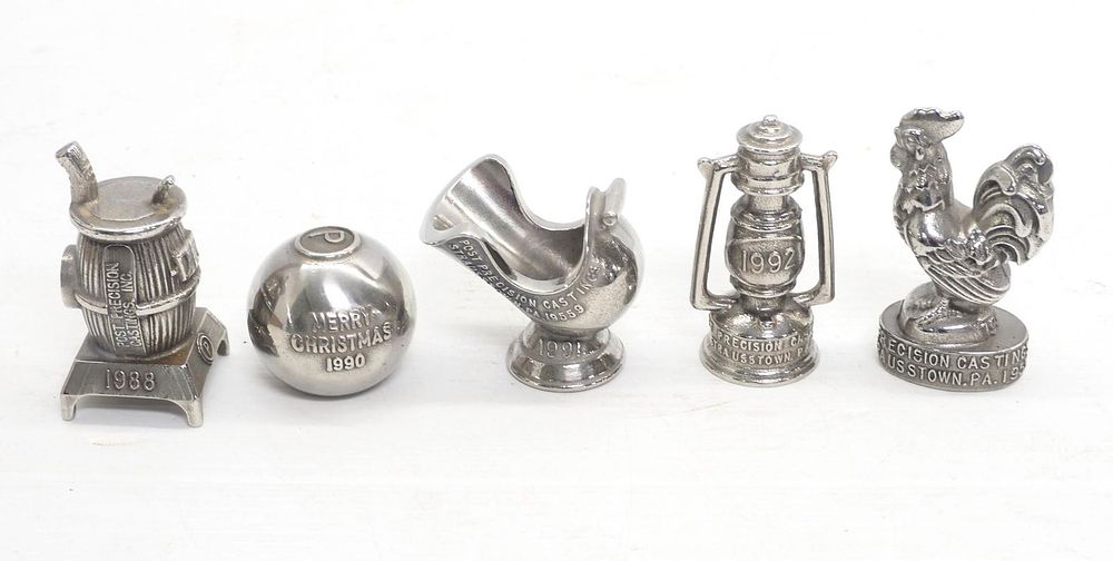Lot 581: (5) Paper weights by Post Precision Castings